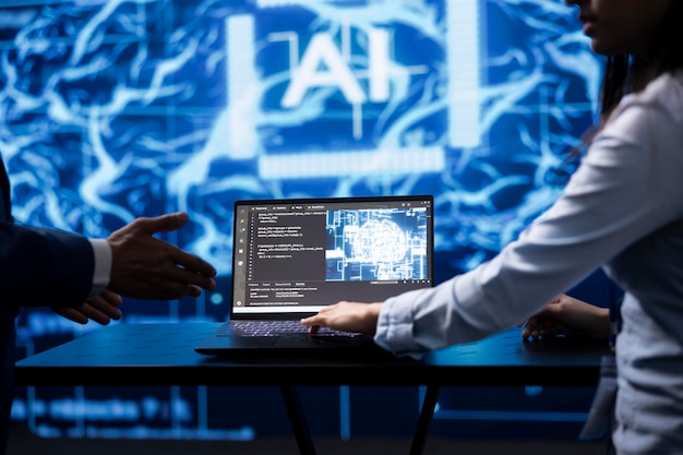 Computer scientist running AI cognitive computing tech on laptop