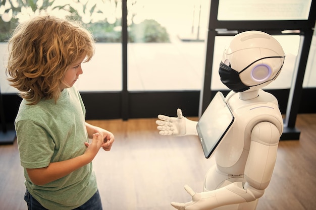 Concentrated child interact with robot artificial intelligence communication