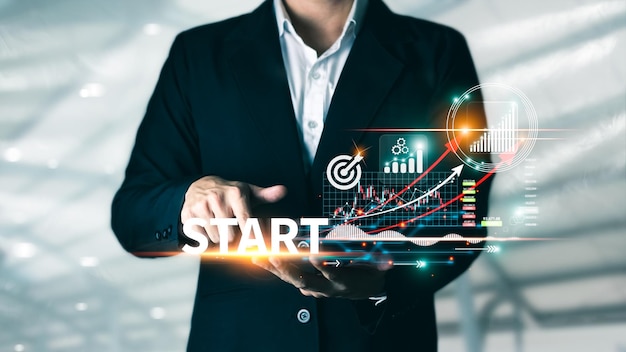 Concept of startup business to be successful Businessman touch tablet screens business icons and network connections on global modern interface