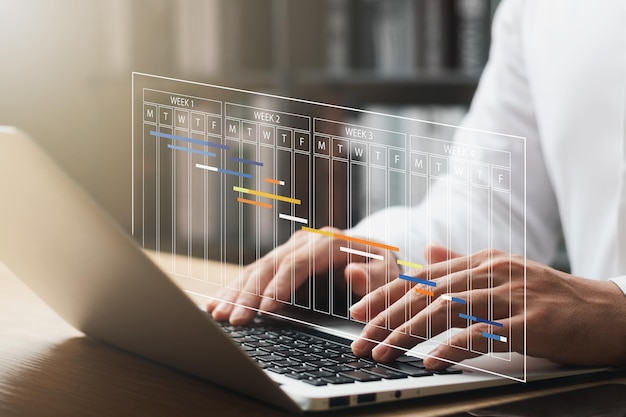 concept of time management and human resources Effectively male businessman using a laptop computer Organizing work in a systematic way