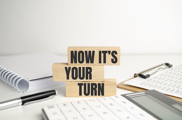 Concept words NOW ITS YOUR TURN on wooden blocks