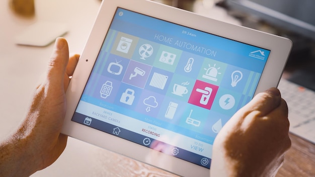 Cropped hand holding digital tablet