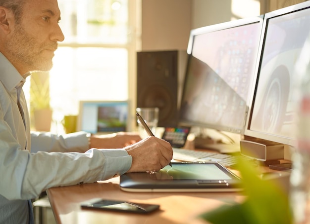 Cropped image of graphic designer working with pen on screen