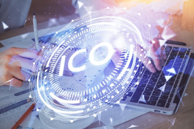 Crypto currency theme hologram with businessman working on computer on background Concept of blockchain Double exposure
