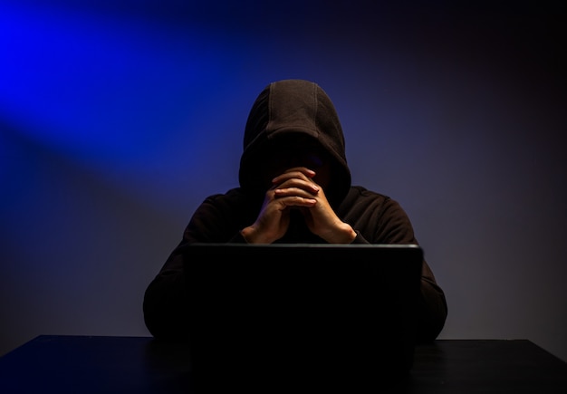 Cyber attack stealing information with program for hack password and personal data.Hacker typing keyboard with laptop for search and attack system.