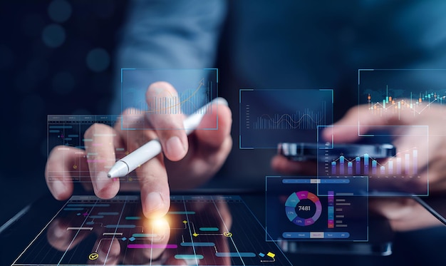 data analytics and analyst working with computer in business management system to make report with kpi and metrics connected to database