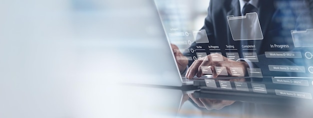 Data management Business developer using Kanban board framework on laptop computer Agile software development document database management concept Business and technology background