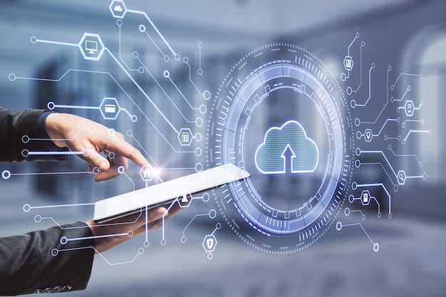 Data storage concept with cloud icon with arrow inside on virtual screen before businessman hands with digital tablet