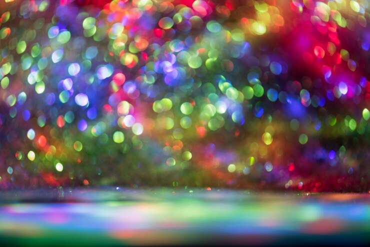 Bild defocused image of multi colored glitters