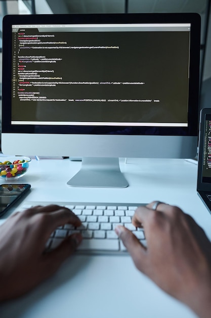 Developer typing codes on computer