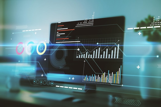 Digital business chart interface on blurry office interior background with computer monitor on desktop Finance trade technology and future concept Double exposure