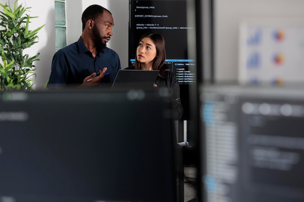 Digital composite image of man using laptop at office