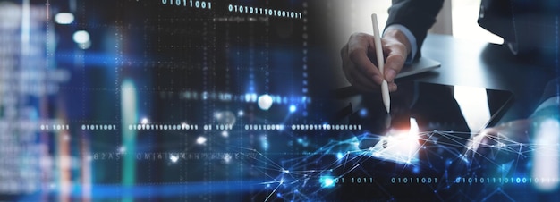 Digital technology concept Man programmer working on tablet for big data management computer code on futuristic virtual interface screen data mining digital software development