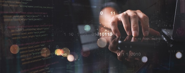 Digital technology software development concept Coding programmer software engineer working on laptop with circuit board and javascript on virtual screen internet of things IoT