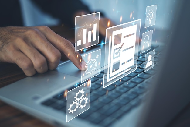 DMS is document management concept Man using a computer to document management in online documentation database and digital file storage system or software records keeping database technology
