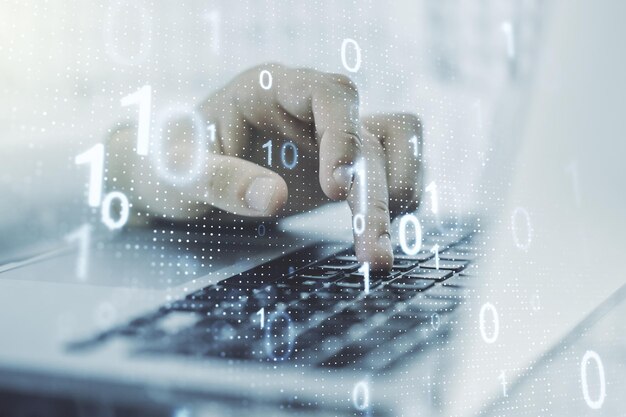 Dobbelt eksponering af kreativt abstrakt binært kode hologram og hænder, der skriver på bærbar computer på baggrund af database og programmeringskoncept