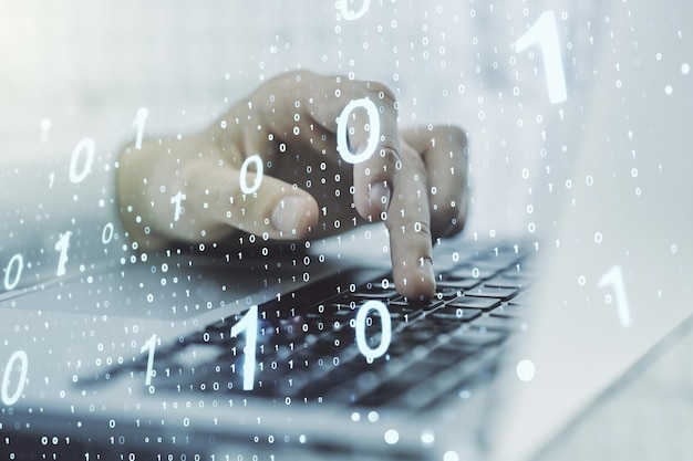 Dobbelt eksponering af kreativt abstrakt binært kode hologram og hænder, der skriver på bærbar computer på baggrund af database og programmeringskoncept