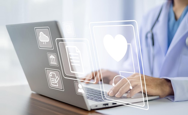 Doctor using technology document management on computer system management for cardiologist