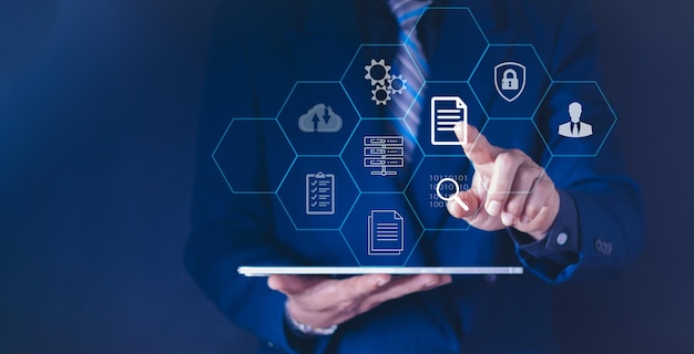 document management system dms is used to store search and manage authentication and user processes for files and corporate data in an organization concept with business manager pointing at icon