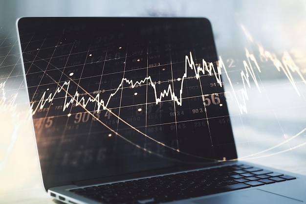 double exposure of abstract creative financial chart on modern laptop background, research and strategy concept