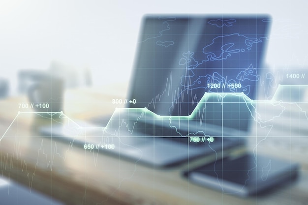 double exposure of abstract creative statistics data hologram and modern desk with computer on background analytics and forecasting concept
