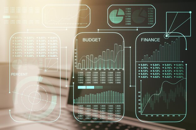 Double exposure of abstract creative statistics data hologram on laptop background statistics and analytics concept