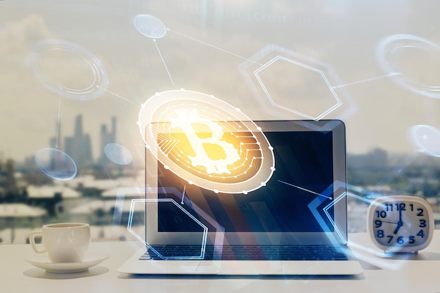 Double exposure of blockchain and crypto economy theme hologram and table with computer background Concept of bitcoin cryptocurrency