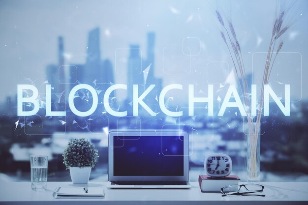 Double exposure of blockchain and crypto economy theme hologram and table with computer background Concept of bitcoin cryptocurrency