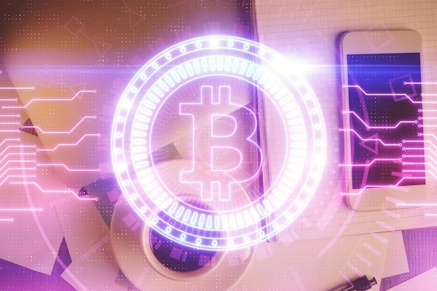 double exposure of blockchain theme hologram over table with phone top view crypto technology concept