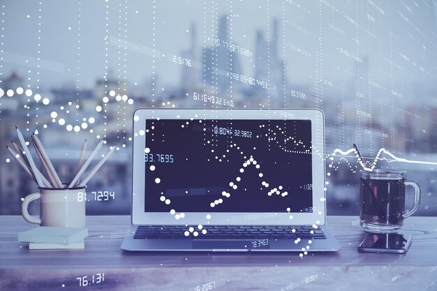 Double exposure of laptop computer and technology theme hologram Concept of freelance work