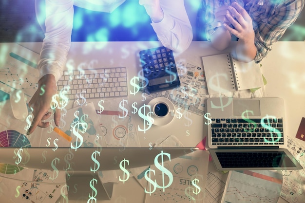 Double exposure of man and woman working together and financial chart hologram drawing market analysis concept Computer background Top View