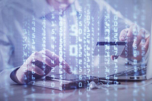 Double exposure of man hands holding a credit card and data theme drawing Ecommerce and technology concept