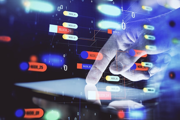 double exposure of man's hand holding and using a digital device and data theme hologram drawing technology concept
