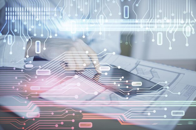 Double exposure of mans hand holding and using a digital device and data theme hologram drawing Technology concept