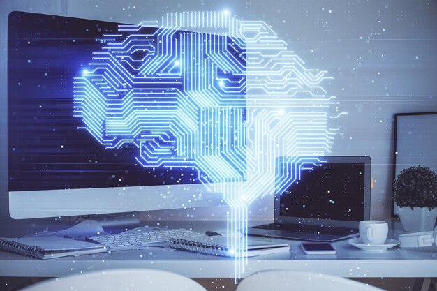 Double exposure of table with computer and brain hologram Data innovation concept