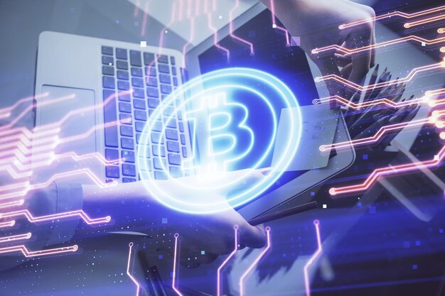 Double exposure of woman hands typing on computer and crypto market theme hologram drawing Blockchain concept