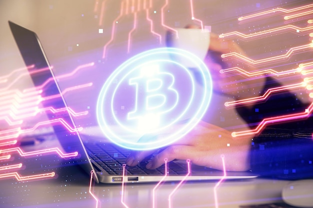 Double exposure of woman hands typing on computer and crypto market theme hologram drawing Blockchain concept