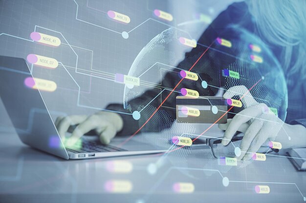 Double exposure of woman online shopping holding a credit card and world map hologram drawing International Ecommerce concept