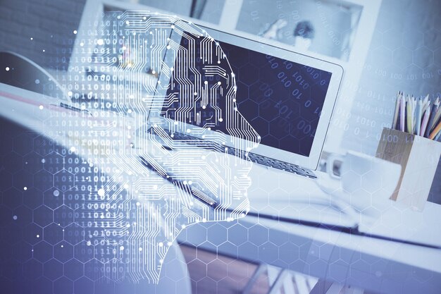 Double exposure of work space with computer and human brain drawing hologram Brainstorm concept