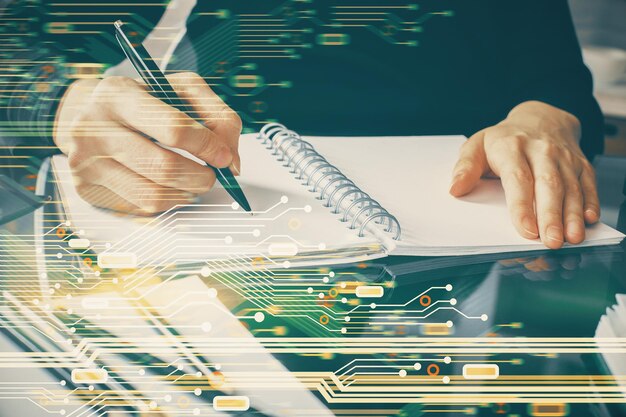 Double exposure of writing hands on background with data solution hologram on front Technology concept Close up