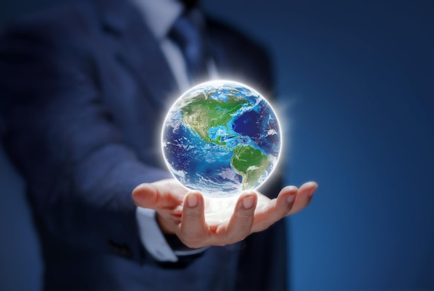 Earth in hand of business man show USA world map Businessman hold Global world for communicate environment save earth worldwide network concept Elements of this image are furnished by NASA