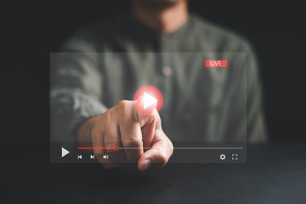 embark on a journey of virtual streaming with a touch as a man's hand engages with the screen watching online videos live concerts and exploring the digital frontier of technology