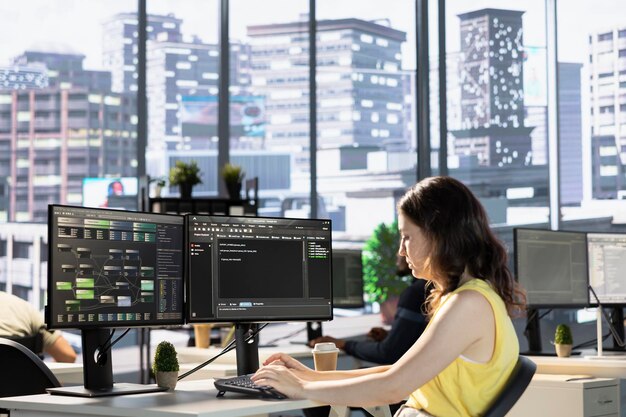 Employee conducting code review to fix bugs in machine learning company software