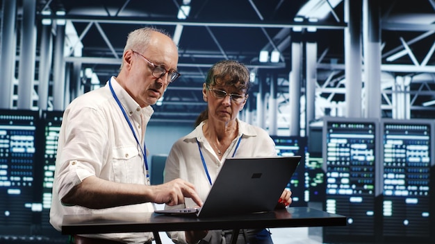 Employees crosschecking server parts