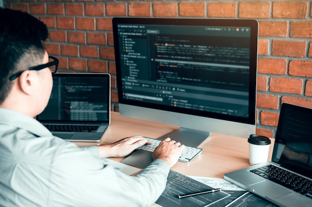Engineer using computer on desk in office