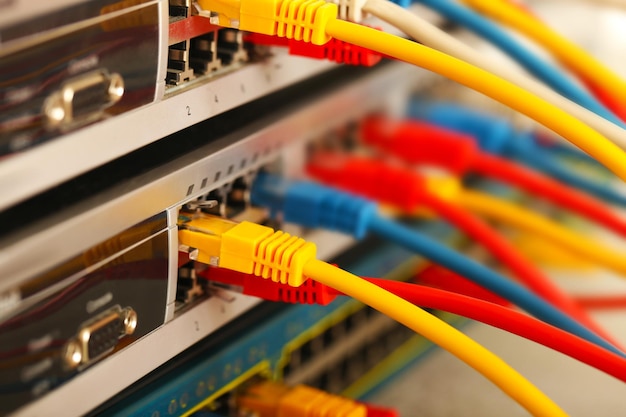 Ethernet cables connected to network switch close up