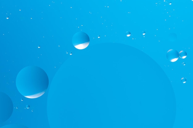 floating blue bubbles on a light blue background create a peaceful and minimalistic abstract design