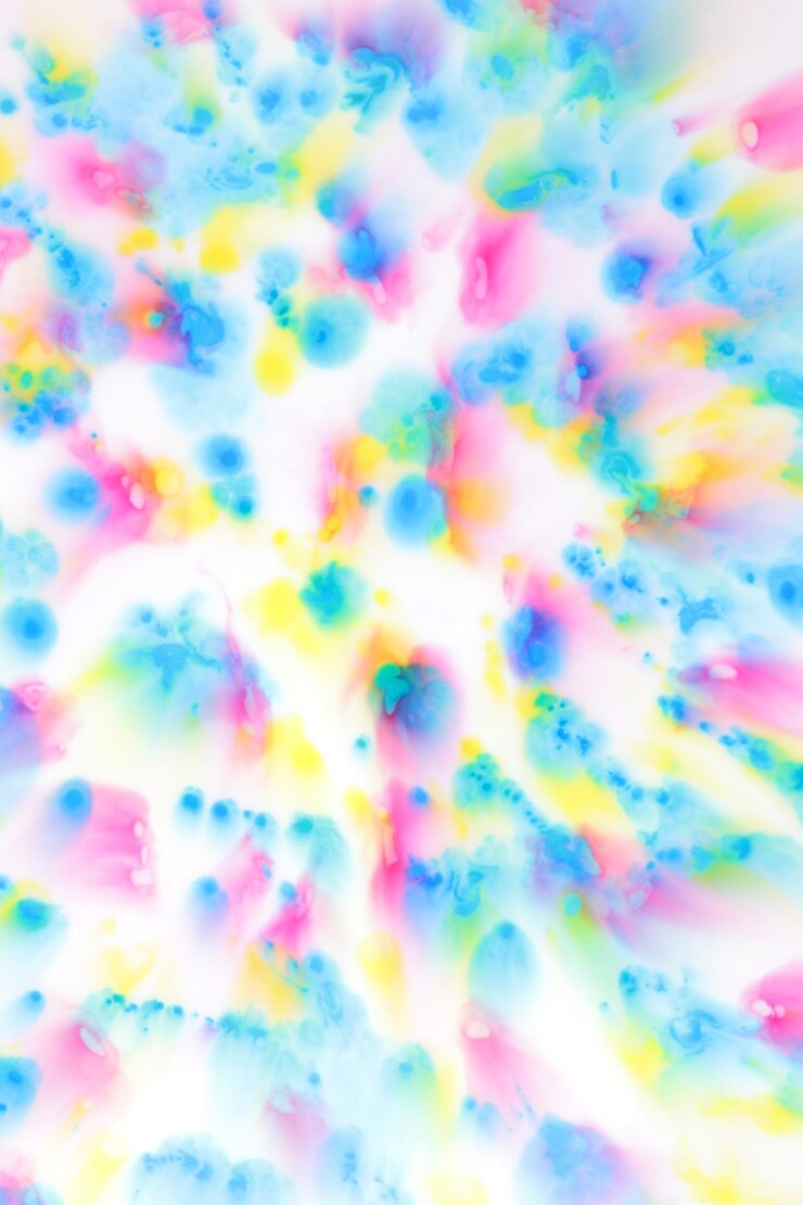 Bild fluid art pink yellow and blue spots on a white background abstract background with splashes of pink yellow and blue color