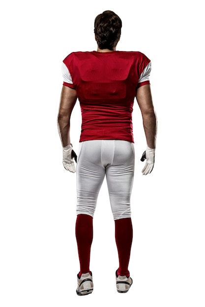 football player with a red uniform walking, showing his back on white