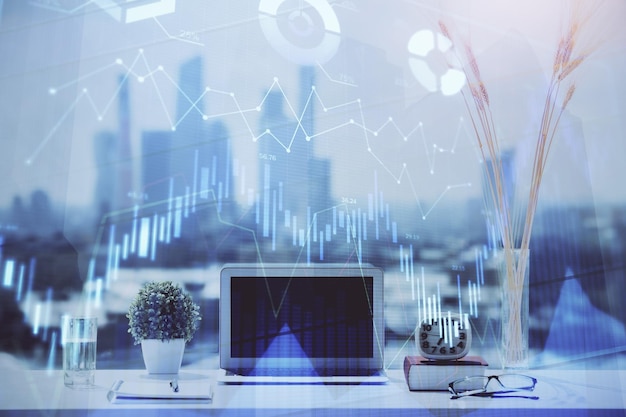 forex chart hologram on table with computer background multi exposure concept of financial markets
